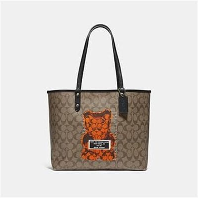 Fashion 4 - REVERSIBLE CITY TOTE IN SIGNATURE CANVAS WITH VANDAL GUMMY